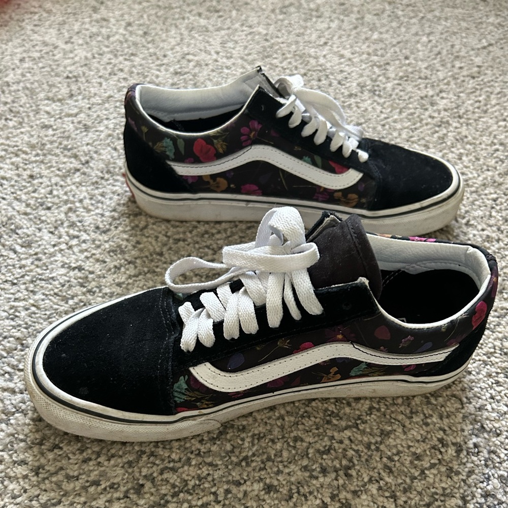 Black vans with flower details